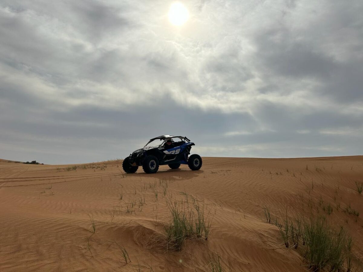 How can you explore the Dubai desert on a dune buggy?